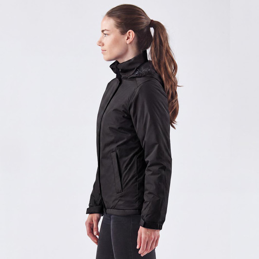 A black women's jacket with a stylish design, featuring a high collar and a slim fit. It has a logo on it.