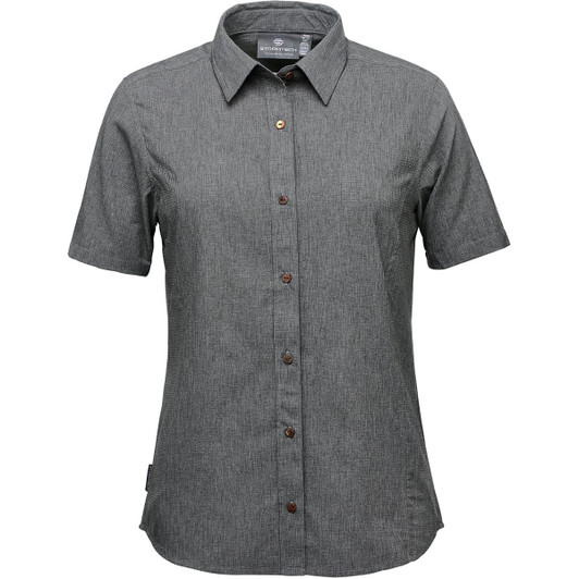 A women's button-up shirt in green with a short sleeve design and brown buttons. It features a logo on the label.
