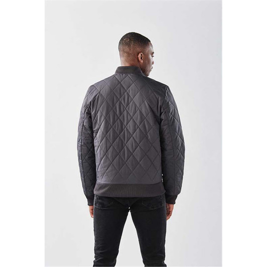A men's quilted thermal jacket in dark grey, featuring a simple design and a logo on the back.