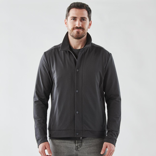 A black men's jacket with a collared design, featuring buttons and a logo. The model stands against a plain background.