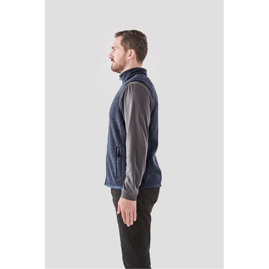 A side view of a men's navy blue fleece vest with a zippered front and one side pocket.