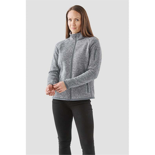 A grey women's fleece jacket with a full zip, featuring a high collar and two side pockets.