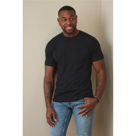 A fitted black men's T-shirt displayed on a model, paired with blue jeans. The shirt features a logo.
