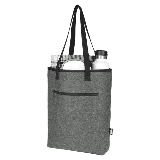 A grey recycled felt cooler tote bag contains a drink bottle, a towel, and features a pocket and black handles.