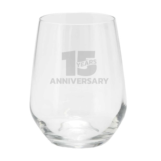 A stemless glass cup with a clear design, featuring a logo and a celebratory inscription for an anniversary.