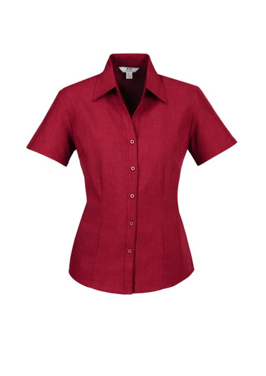 A short sleeve ladies' shirt in burgundy, featuring a button-up design and a collar, with a logo.