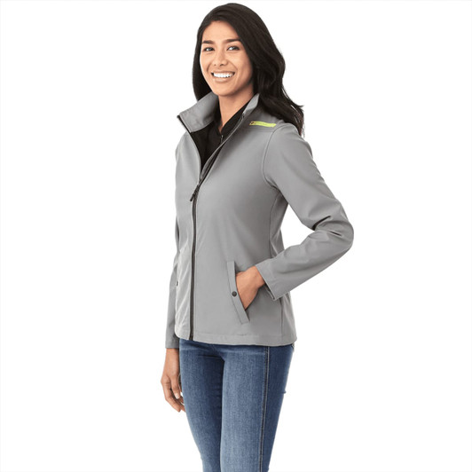 A women's grey softshell jacket with a zip front, high collar, and front pockets, featuring a logo.
