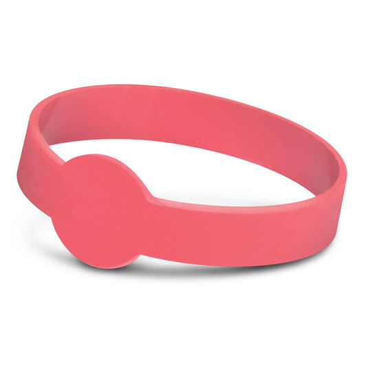 A pink silicone wristband with a circular feature, ideal for exhibitions and events. It has a branding logo.
