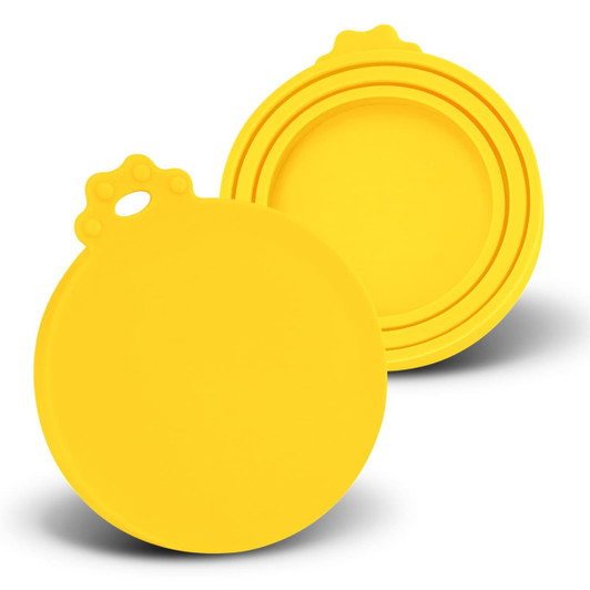A set of yellow silicone reusable can lids in various sizes, featuring a circular design and a loop for easy handling.