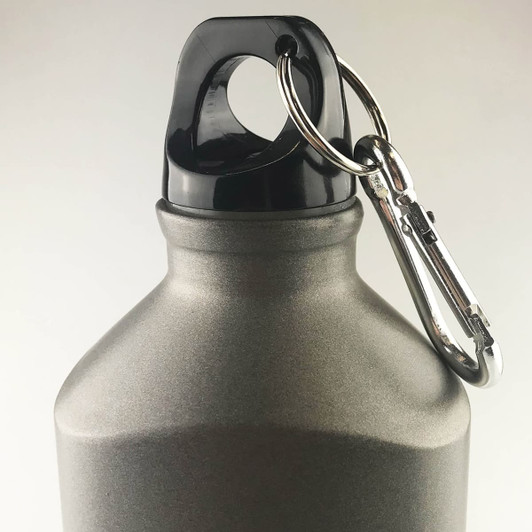 A drink bottle in grey with a black lid and attached carabiner clip for easy carry.