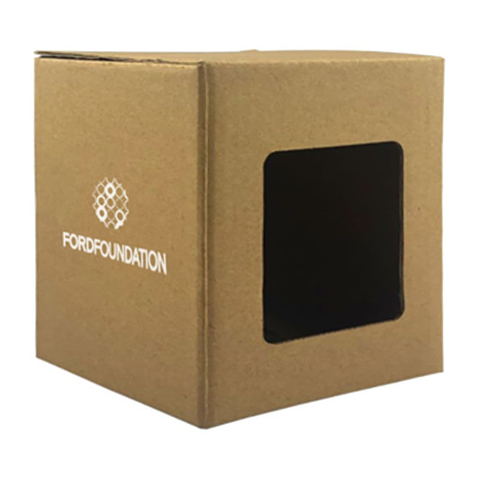A small, brown gift box with a transparent window and a logo on the front.