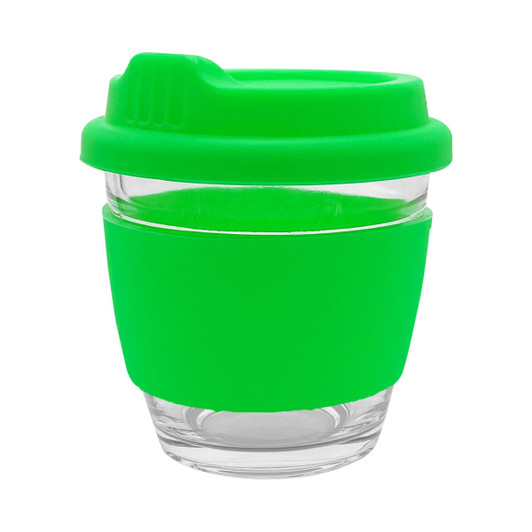 A reusable coffee cup in vibrant green with a silicone sleeve and lid, featuring a glass body and branding.