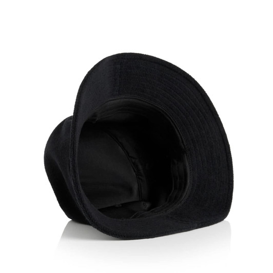 A black Terry Bucket Hat with a wide brim, featuring a logo on the inside.