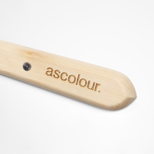 A wooden palette knife with a rounded end and a branding logo on the handle.