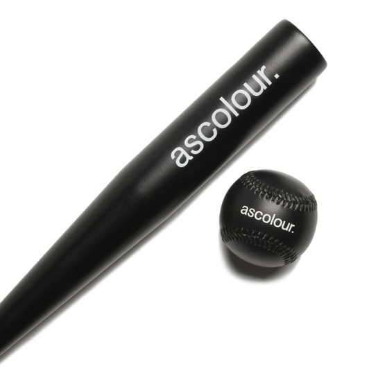 A mini black baseball bat and a black baseball, both featuring a logo.