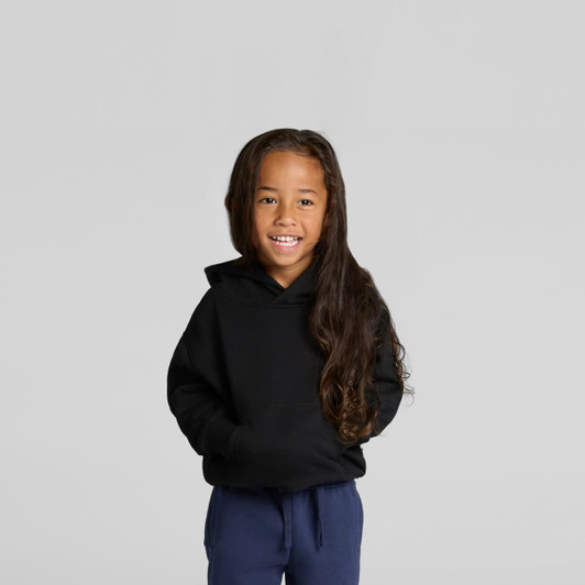 A child smiles while wearing a black hoodie. The hoodie features a front pocket and a hood.
