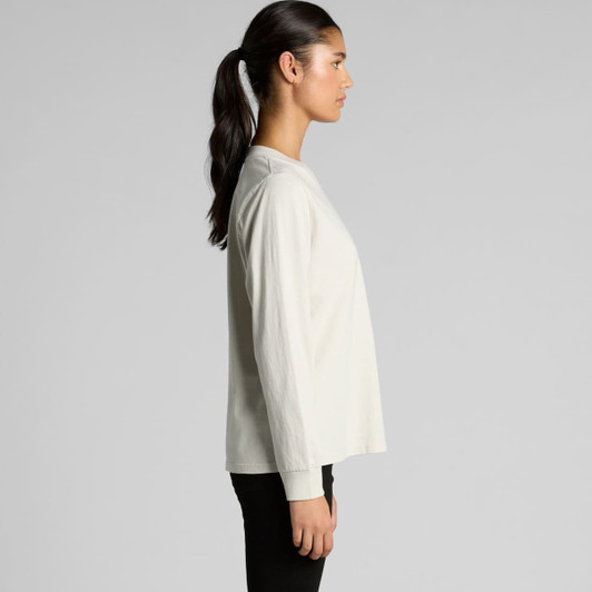 A long-sleeved tee in faded white, featuring a relaxed fit and a side view of a model wearing it.