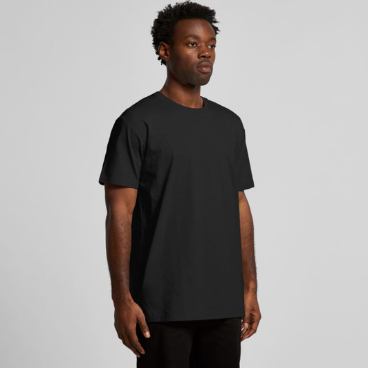 A black T-shirt is displayed on a model, featuring a relaxed fit and a logo on the front.