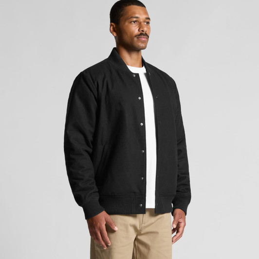 A black felt bomber jacket is displayed on a model, featuring a button-up front and ribbed cuffs.