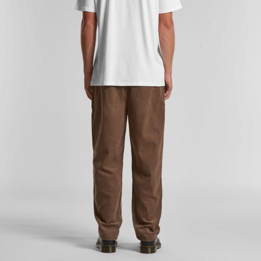 Brown corduroy pants with a loose fit, displayed from the back, paired with a plain white t-shirt.