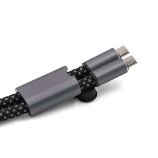 A charging cable with dual connectors, featuring a black braided design and a metallic grey holder.