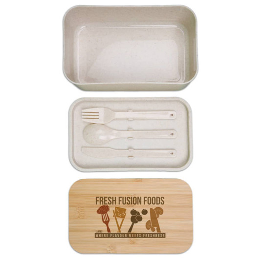 A beige lunch box with a bamboo lid, containing utensils including a fork and spoon. It features a logo.