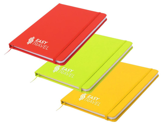A notepad featuring a red, neon green, and yellow cover, each with a logo on the front.