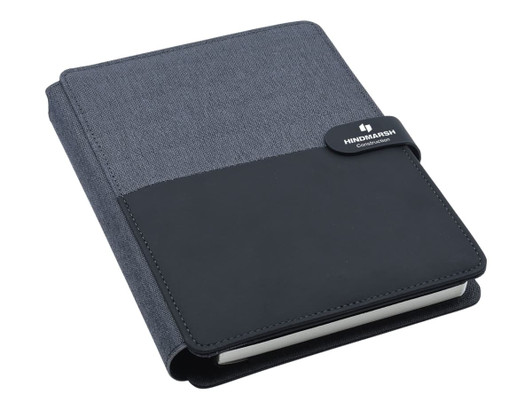 An A5 portfolio in black and charcoal featuring a textured cover and a logo.