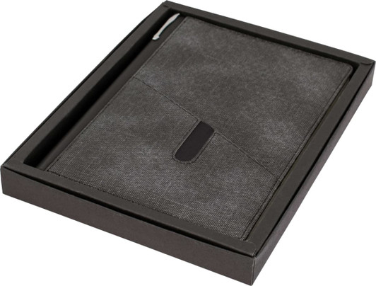 A grey A5 notebook in a sleek black box, featuring a pen loop and a subtle logo.