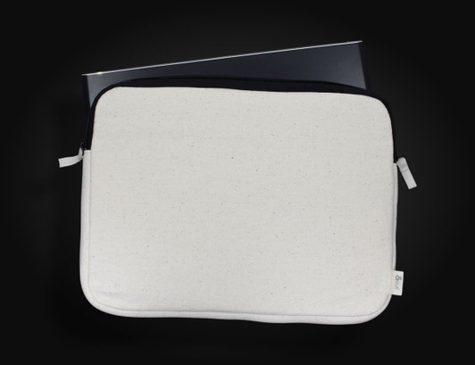 A laptop sleeve in cream and black, featuring a zip closure and a branding logo, designed for a 24cm x 33cm laptop.