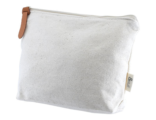 A cream-coloured toiletry or makeup bag with a leather zip pull and a logo on the side.