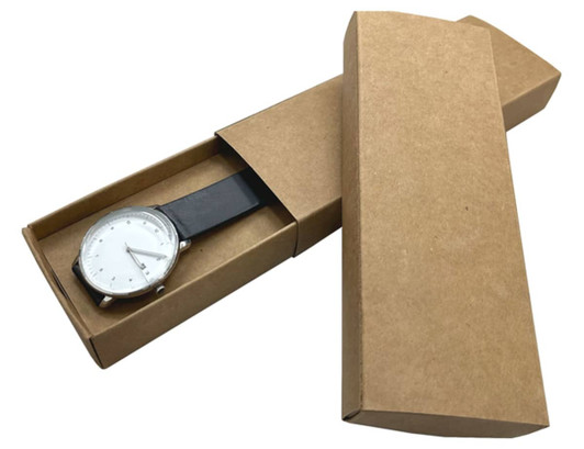 A brown paper watch box, partially opened, revealing a silver watch with a white face and black strap inside.