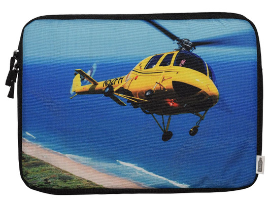 A vibrant laptop sleeve featuring a yellow helicopter flying over a coastal scene, with a black zipper.