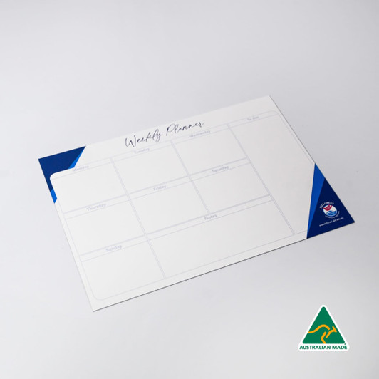 A magnetic whiteboard in white and blue, featuring a weekly planner layout with multiple sections.