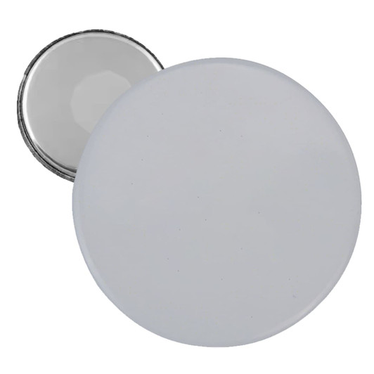 A round button badge with a white front and a metallic backing, featuring a smooth, glossy finish.