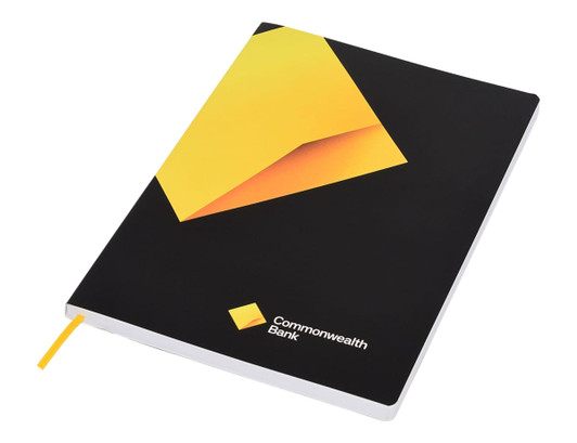 A black notebook with a geometric yellow design and a yellow ribbon bookmark, featuring a logo on the cover.