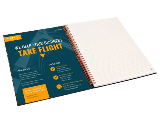 A A4 side-bound notebook with spiral binding, featuring blank pages and a colourful design on the front cover.