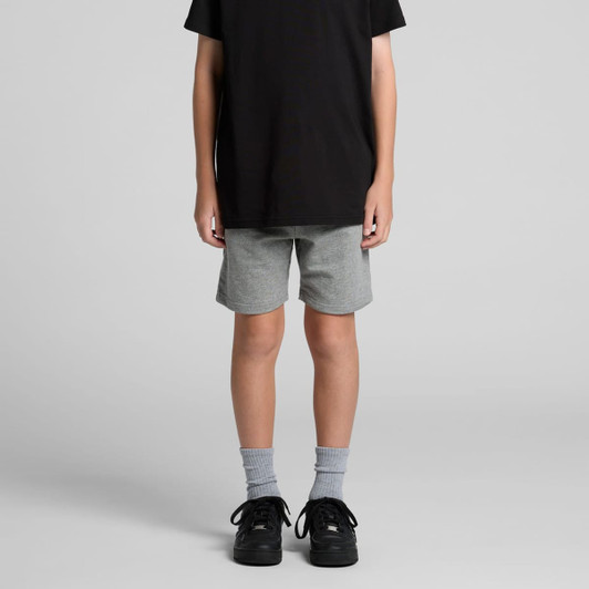 Youth stadium shorts in light grey, featuring a comfortable fit and a stylish design, paired with black shoes and grey socks.