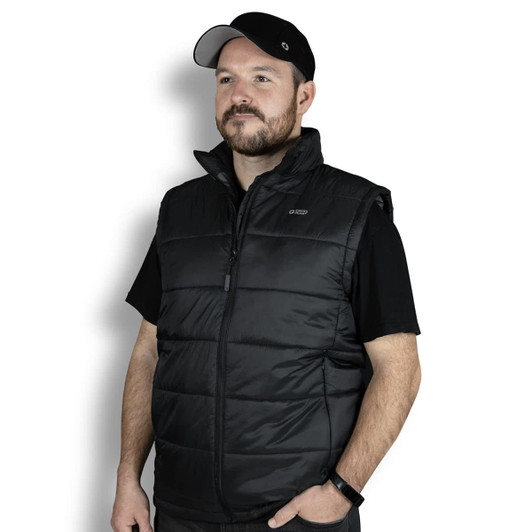 A man wearing a black puffer vest, featuring a zip front and a collar, with a logo on the upper left.