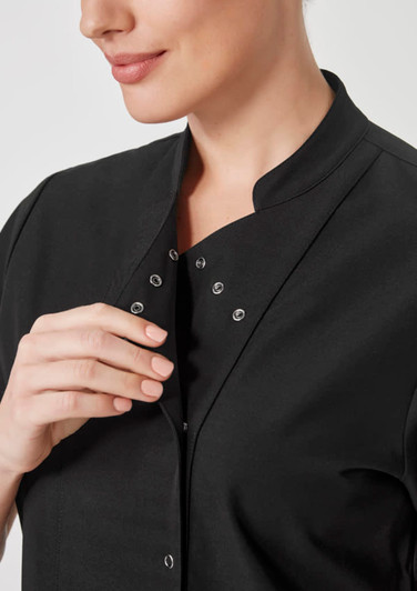 A black women's jacket featuring snap closures at the collar and a sleek design, with a subtle brand logo.
