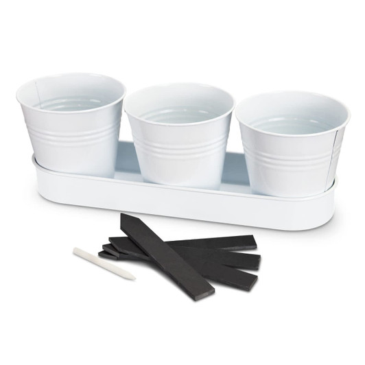 A white keepsake herb planter with three pots on a tray, accompanied by black labels and a white marker.