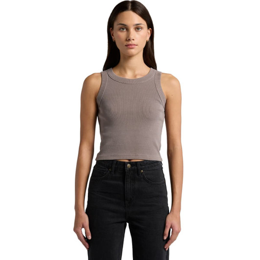 A model wearing a faded organic rib crop tank in a muted grey colour, paired with black high-waisted jeans.