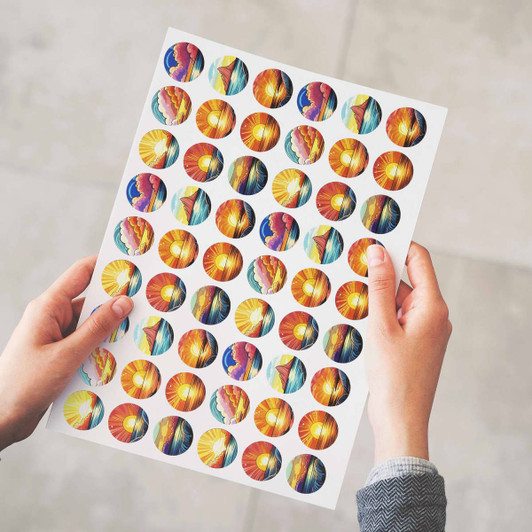 A sheet featuring multiple 26mm matte circle stickers with vibrant designs in orange, yellow, and blue.