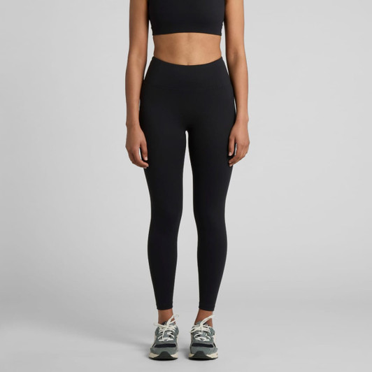 Active seamless leggings in black, styled with a matching crop top and trainers. The product features a logo.