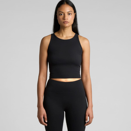 A black active crop tank top displayed on a model, featuring a form-fitting design and a subtle logo.