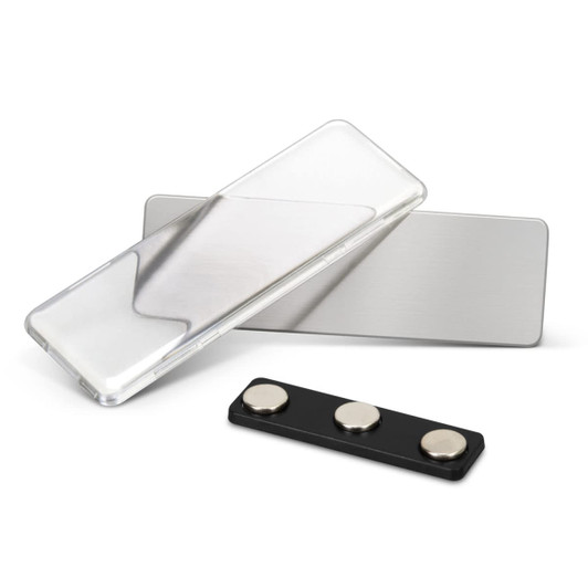 A metal name badge in silver and black with a clear cover and magnetic back attachment.