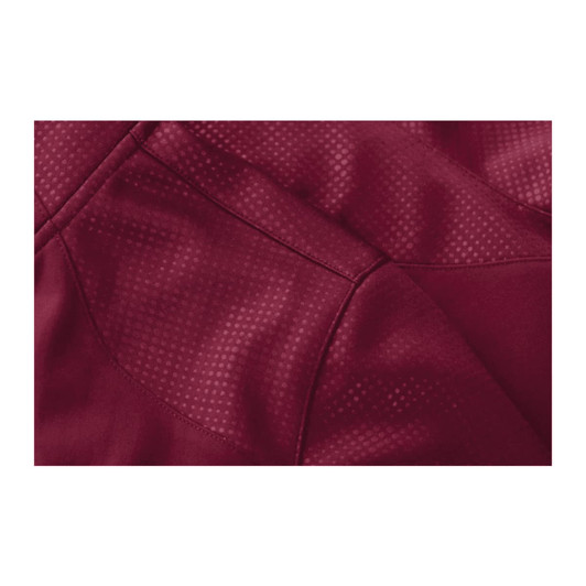 A maroon jacket featuring a textured pattern and zip closure, designed with thumb holes for added functionality.