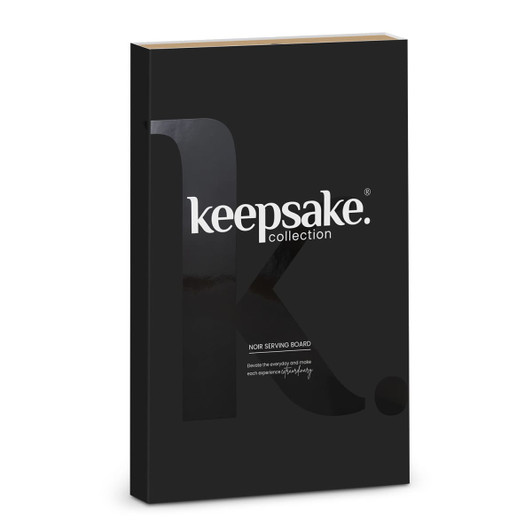 A black box featuring the Keepsake Noir Serving Board, with minimalist branding on the front.
