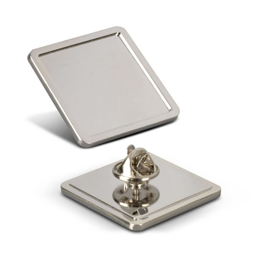 A square large lapel pin with a shiny metallic finish and a secure backing mechanism.