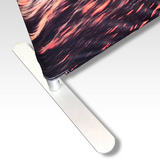 A small stretch media wall with a vibrant, multi-coloured design and a sleek white base stand.